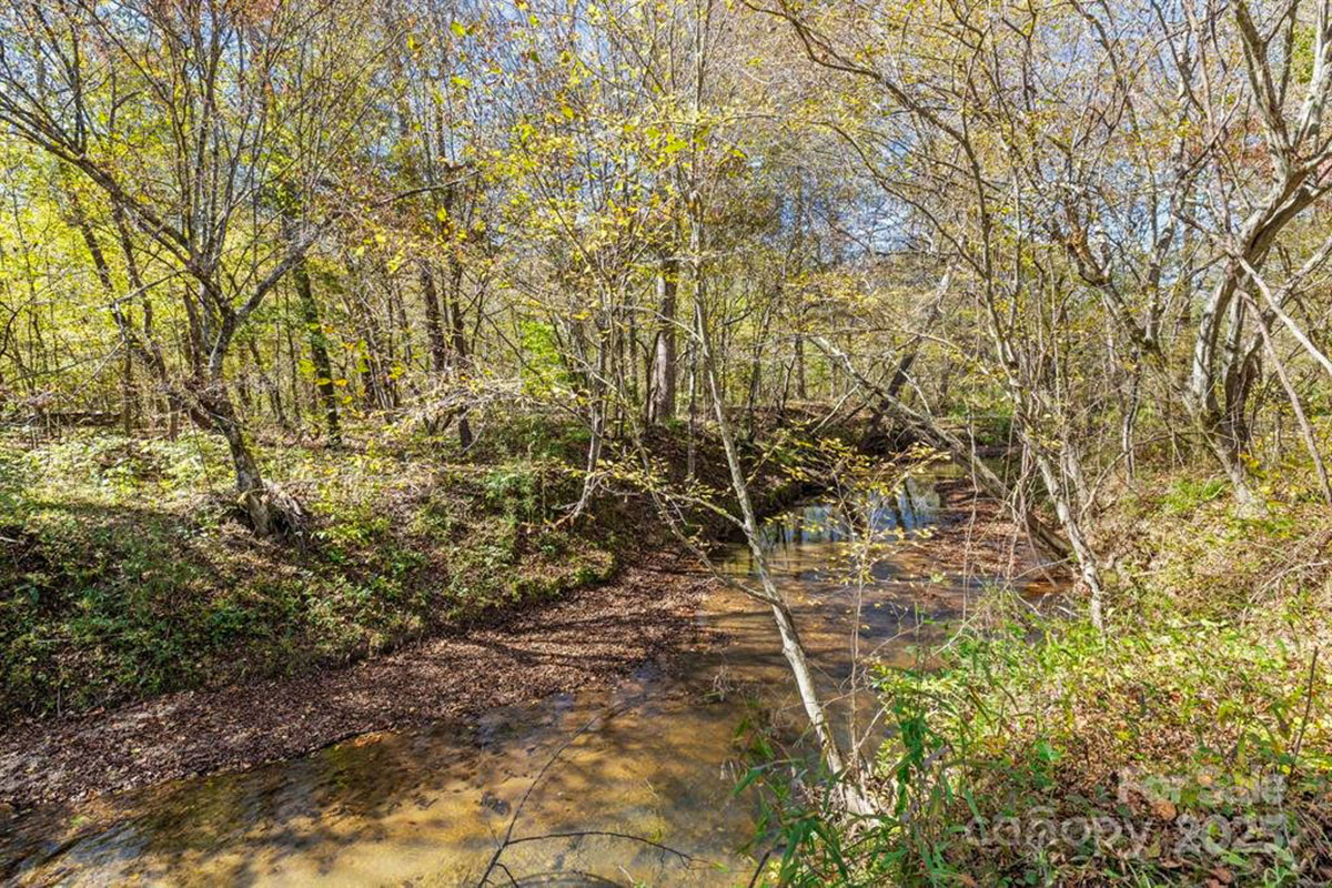 MLS # 4312668 | 8.00 acres | Cabin w/barn and fencing in gated Hearthstone Ridge